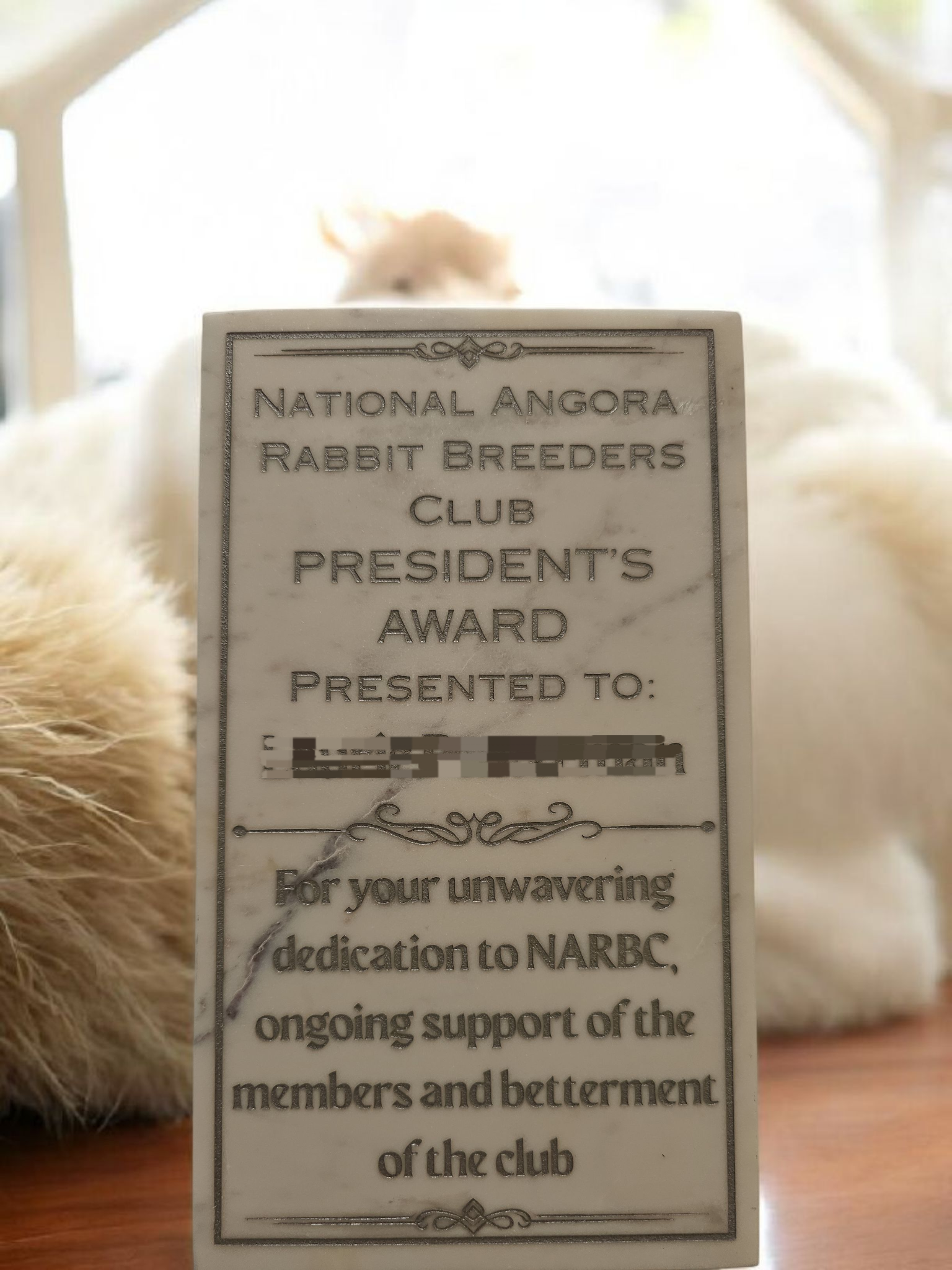 National Angora Rabbit Breeders Club President’s Award plaque; recipient name remains obscured as supplied